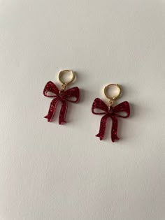 Bow Leverback Hoop Earrings in Red Glitter.  Pretty girl bow earrings. Lightweight acrylic plastic earrings. Laser cut. Handmade with gold plated leverback hoop earrings and jumprings. US Dime pictured for size. Charm is approximately 1 inch in length by 1 inch wide. Cheap Red Earrings, Cheap Red Jewelry For Everyday, Cheap Red Jewelry For New Year, Everyday Cheap Red Jewelry, Cheap Red Hoop Earrings As Gift, Cheap Red Jewelry With Dangling Charms, Cheap Red Jewelry For Birthday Gift, Cheap Red Sweet Earrings, Cheap Red Earrings With Heart Charm