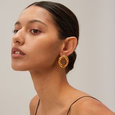 The Oh Factor Gold Earrings are all about striking balance—bold yet minimal, modern yet timeless. Featuring a sculptural, open-loop design, these earrings give a refined edge to any look. Their high-polish gold finish shines effortlessly against the skin, making them the ultimate statement piece without feeling overdone. Whether you’re going for casual or upscale, these earrings bring a touch of artistic flair that elevates your vibe instantly. Creative Texture, Texture Metal, Popular Jewelry, New Chic, Body Chain Jewelry, Stylish Jewelry, Chains Jewelry, Shape Patterns, Hair Jewelry