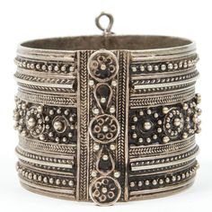 Vintage Moroccan Berber tribal bracelet Moroccan tribal bracelet from the High Atlas of Morocco. Handcrafted by Berber women using Moroccan silver nickel. The ethnic Nomadic and Bedouin jewelry from the Maghreb and North Africa is usually made of silver and the designs are full of symbolism to protect from the evil eye. This bracelet is a stunning piece of Tribal jewelry. Hinged closure. Measures: Inside 2.5" in diameter, outside 3" in diameter. Ethnic Origin: African Features: Ethnic Regional & Hammered Metal, Berber Women, Vintage Moroccan, North Africa, Silver Cuff, Hand Carved, Cuff, Carving, Silver