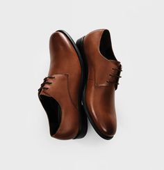 Brown Leather Shoes | The Black Tux Modern Leather Oxfords With Brogue Detailing, Modern Brown Dress Shoes With Leather Sole, Brown Leather Dress Shoes With Round Toe, Brown Leather Dress Shoes With Brogue Detailing, Modern Brown Leather Shoes With Leather Sole, Cognac Leather Dress Shoes For Derby, Brown Leather Lace-up Shoes With Almond Toe, Brown Leather Oxfords With Round Toe, Brown Leather Oxfords With Leather Lining