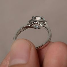 This is a gorgeous handmade creation. Its beauty is its simplicity & Elegance. The 5*7 mm oval shape faceted natural aquamarine is crafted in solid sterling silver and with rhodium plated. All item is sent in a beautiful gift box If you have any idea of design your ring,pls contact me directly. You can realize more lovely stuff clicking the link https://www.etsy.com/shop/knightjewelry?refshopsection_shophome_leftnav Please leave the correct address and you phone number for delivering success Oval Aquamarine Diamond Ring In White Gold, Oval Topaz Promise Ring With Polished Finish, Modern Aquamarine Promise Ring, Oval Moonstone Promise Ring With Polished Finish, Modern Oval Crystal Ring For Anniversary, Oval Brilliant Cut Topaz Ring For Gift, Oval Brilliant Cut Topaz Ring As Gift, Oval Blue Topaz Diamond Ring With Brilliant Cut, Oval Aquamarine Diamond Ring Gift