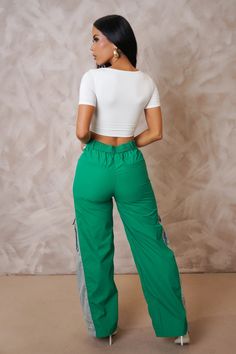 Discover our trendy cargo denim pants, perfect for casual wear with multiple utility pockets and a comfortable mid-rise waistline. Available now at Mabel Love Co. Green High Waist Cargo Pants For Summer, Green Pants With Side Pockets For Spring, Green Straight Leg Parachute Pants For Spring, High Waist Green Cargo Pants For Spring, High Waist Green Bottoms With Patch Pockets, Spring Green Pants With Side Pockets, Green Cargo Style Parachute Pants For Spring, Trendy Green Straight Leg Cargo Jeans, Green Cargo Pants With Patch Pockets