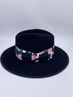 ‘Saija’ is our exclusive signature fedora that exudes luxury vibes like no other. Her name means Crowned Heads in the African language and rightfully so, as she is truly fit for a Queen. ‘Saija’ is not only a top quality fedora but she is a sure head turner and show stopper. Do not be afraid to mix her with other prints and patterns and experiment with other colors to add even more excitement to your entire look. Pair her with a blazer and jeans or a cute dress and heels and you will certainly b Luxury Curved Brim Fedora For Spring, Modern Adjustable Fedora With Short Brim, Luxury Spring Fedora Hat, Modern Fedora With Adjustable Fit And Short Brim, Luxury Flat Brim Fedora For Spring, Luxury Fedora With Flat Brim, Luxury Adjustable Fedora Hat, Luxury Fitted Fedora With Flat Brim, Modern Fitted Fedora With Short Brim