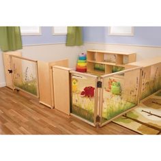 a child's play room with wooden furniture and toys