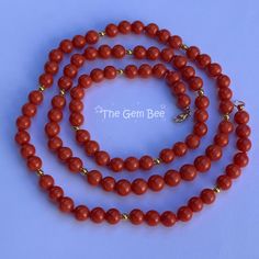 DESCRIPTION: Thank you for coming in! Classic 18K solid gold necklace with Sardinia Coral sphere beads from the Mediterranean, no dye, 100% natural color. You'll get the necklace you see! SIZE of coral: Appr. 6.6mm-7.5mm Weight: 40.32grams MATERIAL: 18k Solid gold, salmon coral Classic Orange Necklace For Gift, Luxury Beaded Necklaces With Gemstone Beads, Elegant Yellow Gold Beaded Necklace With Gemstones, Formal Single Strand Necklace With Oval Beads, Classic Orange Necklace For Gifts, Pearl Necklace With Polished Beads, Luxury Round Gemstone Bead Necklaces, Elegant Round Jewelry With 108 Beads, Luxury Rondelle Necklace For Gift