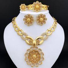 Afraic Jewelry -Jewelry Sets For Women Rhinestone Jewelry Large Pendant Necklace Set Flower Earrings product name: latest jewelry set designs for women postage: Free Shipping plating Color: Gold Plated material: alloy Style: TRENDY Shape\pattern: Flower Origin: Mainland China Occasion: wedding Model Number: 240 Metals Type: Zinc alloy Material: Metal Jewelry Sets Type: Necklace/Earrings/Ring/Bracelet Item Type: Jewelry Sets Included Additional Item Description: Necklace Earrings Bracelet Ring Se Gold Plated Flower Shaped Jewelry, Elegant Metal Flower Jewelry Sets, Elegant Flower Shaped Metal Jewelry Set, Silver Flower-shaped Metal Jewelry Sets, Crystal Flower-shaped Jewelry For Gifts, Melon Seeds, Large Pendant Necklace, Jewelry Set Design, Set Designs