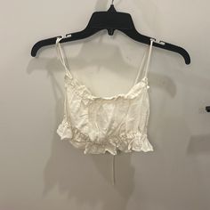 H & M Ruffled White Crop Top - Size Medium; Runs Small. Typically I Am A Small. Ties In Back To Allow For Strap Adjustments. Never Worn. Casual White Tops With Ruffled Straps, Flirty Ruffled Crop Top For Brunch, Flirty White Tops For Vacation, Flirty White Top For Vacation, Flirty Cotton Crop Top For Spring, Feminine Ruffled Crop Top For Vacation, White Trendy Top With Ruffled Straps, Chic Cotton Tops With Ruffled Straps, White Trendy Tops With Ruffled Straps