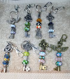 a collection of key chains and charms on a towel