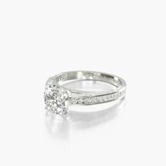 a diamond engagement ring on a white background