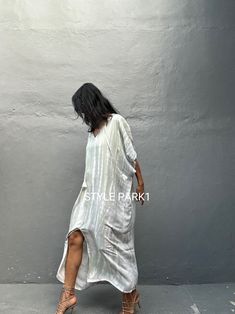 Beachwear Dresses With Split For Beach Cover-up, Beachwear Maxi Dress With Side Slits For Beach Cover-up, Bohemian V-neck Maxi Dress With Side Slits, Chic Maxi Dress With Side Slits For Beach, Maxi Dress With Side Slits For Beach Cover-up, Beach Cover-up Maxi Dress With Side Slits, Flowy Maxi Dress With Side Slits For Vacation, Chic Long Summer Kaftan, Long Dress With Side Slits For Vacation