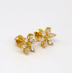 22 karat or 22carat yellow gold handmade floral stud earring, excellent customized cubic zirconia stone stud , fancy party wear earring.Metal-22kt yellow gold.Item type-Stud.Size-10 to 11 mm approx.Weight-3.450 grams.purity-91.6% pure gold.Makes excellent gifting or collectible items. Belly Dance Jewelry, Dance Jewelry, Floral Studs, Fancy Party, Stone Studs, Personalized Wedding Gifts, Screw Back Earrings, Pure Gold, Stud Earring