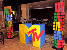 several rubik cubes are on display in a lobby