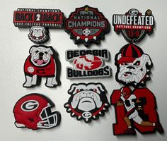 the decals on the refrigerator are all different colors and sizes, including bulldogs