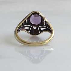 Details: Victorian 14K gold Art Deco amethyst ring circa 1930's. Beautiful deco design, with leaf inspired pattern. The lovely amethyst measures 6.7mm x 6.7mm, and sits about 5.5mm from the finger. The setting measures 15.4mm from top to bottom. The ring is in excellent condition. Please ask all necessary questions prior to placing an order. Measurements: The size is 7 US and can be sized for a fee. Condition: The overall all condition of this ring is excellent condition and the stone is securel Heirloom 14k Gold Solitaire Amethyst Ring, Heirloom Solitaire Purple Amethyst Ring, Classic Amethyst Ring Stamped 14k, Heirloom Yellow Gold Amethyst Solitaire Ring, Heirloom Yellow Gold Solitaire Amethyst Ring, Heirloom Amethyst Solitaire Ring In Yellow Gold, Heirloom Amethyst Ring In Yellow Gold With Bezel Setting, Heirloom 14k Gold Round Cut Amethyst Ring, Art Deco Amethyst Ring In Yellow Gold