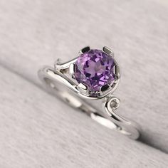 ◆ The ring is handcrafted from sterling silver and decorated with a dazzling 7*7 mm amethyst. It is suitable for engagement/anniversary/daily occasion. ◆ Production Description: Main stone Type: Natural Amethyst Main Stone Shape: Round Cut Main Stone Size: 7*7 mm(1.25ct) Side stone: None Metal: 925 Sterling silver - Other options available in the drop down menu ◆ Customization: √Free for Add Engraving √Other Metal Type Available √Other Gemstones & Shapes Available √Personalization Requests Avail Elegant Amethyst Crystal Ring With Center Stone, Elegant Amethyst Birthstone Crystal Ring, Elegant Amethyst Promise Ring With Accent Stones, Elegant Amethyst Birthstone Ring With Prong Setting, Elegant Amethyst Birthstone Ring For Promise, Elegant Purple Solitaire Birthstone Ring, Elegant Purple Birthstone Ring With Round Cut, Elegant Purple Crystal Ring With Prong Setting, Elegant Purple Birthstone Promise Ring