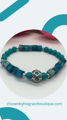 This is a beautiful beaded bracelet is made with a Tibetan silver focal bead with aqua rhinestones. There are Imperial Jasper cube beads, Aqua glass round beads and silver spacer beads. Tibetan silver focal bead is .5"Imperial Jasper cube beads are 6mm.Aqua glass round beads are 6mm. Silver spacer beads are 4mm. Thank you for visiting Chosen By His Grace Boutique! Spiritual Rondelle Beaded Bracelet With Spacer Beads, Turquoise Stretch Bracelet With Spacer Beads As Gift, Turquoise Czech Glass Beaded Bracelet With Faceted Beads, Turquoise Czech Glass Bracelets With Round Beads, Turquoise Czech Glass Bead Bracelets, Turquoise Czech Glass Round Beads Bracelet, Metal Beaded Bracelets For Jewelry Making, Turquoise Bracelet With Polished Beads As Gift, Turquoise Czech Glass Beaded Bracelets