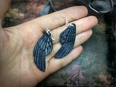 "These stylish tooled leather raven wings earrings with metallic silver or blue sheen would become a great addition to your dark look :) Even those who are allergic to alloys may wear these earrings since they've got sterling silver hooks. Earrings are ~7x2 cm (2 3/4 x 3/4\"). Color slightly changes depending on a lighting and the angle of view. You may choose a pair with silver or blue/red/green/golden sheen. Let me know your preferences upon purchase and I'll proceed. If you prefer some simila Crow Wings, Leather Creations, Raven Wings, Fantasy Earrings, Wings Earrings, Leather Inspiration, Leather Jewellery, Dark Look, Polymer Clay Jewelry Diy