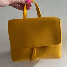 Yellow Mansur Gavriel Bag With Dust Bag And Strap. Tags Still Attached. Selling Because I Haven’t Reached For It Since Buying It Last Summer. Price Negotiable Within Reason. I Will Include The Farfetch Receipt With Purchase And Poshmark Will Authenticate It For Free. Classic Yellow Shoulder Bag With Top Carry Handle, Yellow Satchel With Detachable Strap For Travel, Classic Yellow Satchel With Top Carry Handle, Yellow Travel Satchel With Detachable Strap, Classic Yellow Satchel With Detachable Handle, Modern Yellow Bag With Detachable Strap, Classic Yellow Top Handle Bag, Chic Yellow Top Handle Bag, Classic Yellow Satchel With Adjustable Strap