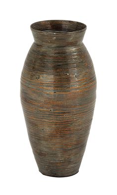 a brown vase sitting on top of a white surface