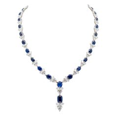 Finely crafted in 18K white gold featuring pear- and trillion-cut diamonds weighing a total of approximately 26.00 carats and oval cushion-cut sapphires weighing a total of approximately 32.00 carats. Circa 1960s-70s. Gold Drop Necklace, Diamond Drop Necklace, Necklace Emerald, Blue Sapphire Necklace, Diamond Necklace Designs, Boot Jewelry, Chic Earrings, Harry Winston, Expensive Jewelry