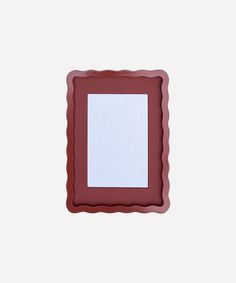 a red frame with a white sheet of paper in the middle