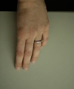 Two inseparable interlocking bands, one slender and the other with a bit of extra weight. Handcrafted in solid sterling silver with a polished finish. A distinct and timeless piece from our most recent series of rings signifying closeness. This ring looks beautiful on its own, but it can be layered with other silver and gold pieces as well. Thinner band: 1.5mm, 925 sterling silver Heavier band: 2.0mm, 925 sterling silver Shown in the fourth photo with our Gold Lovers Ring. Can't find your size? Minimalist Jewelry For Anniversary With Shiny Finish, Minimalist Shiny Jewelry For Anniversary, Minimalist Silver Double Band Jewelry, Elegant Stackable Sterling Silver Signet Ring, Elegant Sterling Silver Stackable Signet Ring, Silver Double Band Jewelry With Modern Twist, Modern Twist Silver Double Band Jewelry, Elegant Sterling Silver Stackable Engraved Ring, Elegant Stackable Engraved Sterling Silver Ring