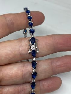 Vintage Cubic Zirconia Bracelet Clear blue Crystal Tennis 7.5 inches All jewelry is shipped free in the US in a nice gift box. Check out our over a THOUSAND great reviews Engraving is $4 per letter and is not always perfect depending on the piece. It can take a few days if the jeweler is busy. This is payable to Paypal Judithsltd@gmail.com Blue Jewelry With Jubilee Bracelet For Anniversary, Sapphire Crystal Bracelet, Blue Cubic Zirconia Crystal Bracelet, Sapphire Jubilee Bracelet Jewelry Gift, Elegant Blue Jubilee Crystal Bracelet, Formal Blue Cubic Zirconia Bracelets, Blue Cubic Zirconia Bracelets For Formal Occasions, Elegant Blue Cubic Zirconia Crystal Bracelet, Fine Jewelry Blue Bracelets