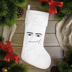 a christmas stocking with a face drawn on it