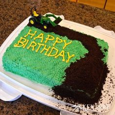 a birthday cake with green and brown frosting on it that says happy birthday john deere