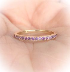 3/4 Eternity Band Ring with Pave Set Natural Amethysts MaterialSolid Gold (14K & 18K) FinishHigh Polished /Shiny FitStandard PlatingRhodium/ Platinum Family (ONLY if white gold selected) Width1.5 mm Height1.5 mm EdgesMilgrain/ Miligrain SettingPave StoneNatural Amethyst QualityAAA Cut and ShapeDiamond Cut, Round Total Caratapx 0.30 ct Click below to add laser engraving. https://www.etsy.com/listing/631070916/laser-engraving?ga_search_query=laser%2Bengraving&ref=shop_items_search_1&fr Classic Lavender Jewelry For Wedding, Purple Half Eternity Ring For Anniversary, Purple Round Band Jewelry For Wedding, Purple Round Band Wedding Ring, Purple Wedding Ring With Round Band, Elegant Wedding Eternity Band With Birthstone, Purple Halo Jewelry For Wedding, Amethyst Wedding Ring In Round Band Shape, Gold Amethyst Ring With Round Band For Wedding