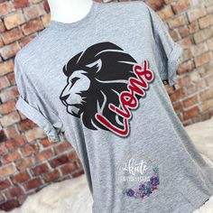 Treat yourself or anyone in your life to this awesome School pride tshirt. Sport your Lions spirt shirt. This design is a cardinal red color. Great for all occasions. And great for supporting your lionsteam. Shirt is made of 100% polyester and soft to the touch. To get the best wear from your shirt please 1. Wash with mild detergent 2. Do not use fabric softener 3. Do not use bleach 4. Tumble dry low. Please enjoy your shirt as I know we have enjoyed all the ones we have made for ourselves!! Ple High School Staff Shirts, Lion School Spirit Shirts, Spirit Tees School, Lions School Spirit Shirt, School Mascot Shirt Ideas, High School Spirit Shirts, Elementary School Tshirt Designs, Spirit Wear Ideas, High School Spirit Wear