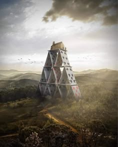 a pyramid shaped structure in the middle of a forest with birds flying around and trees