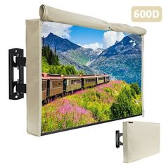 an image of a wall mounted projector screen with mountains in the background and pink flowers