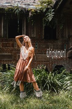 "⫸ We ship by EXPRESS EMS now for fast & safe delivery! Tiered Midi Dress with Fringes is another playful addition to our Boho Alma Libra collection. Gorgeously feminine and so pleasant to wear, it will look amazing with heeled sandals or our ethnic canvas boots. Stunning long linen fringe on the neckline complete the Boho Chic look. Open back and midi length adds the charm and makes it even more suitable for hot and lazy summer days. It is very floaty by design. Light, soft and natural bamb Flowy Bohemian Knee-length Dress, Flowy Knee-length Bohemian Dress, Knee-length Bohemian Boho Dress, Bohemian Knee-length Sundress For Beach, Flowy Bohemian Mini Dress For Festival, Summer Free-spirited Boho Print Dress, Hippie Brown V-neck Dress, Brown V-neck Boho Dress For Festival, Brown Boho Dress With Boho Print For Summer