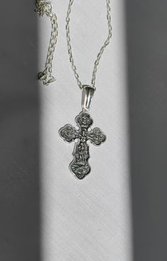 Necklace with a large solid Orthodox cross with an inlaid crucifixion of Jesus Christ. On the reverse side of the cross is depicted the Holy Virgin, guarded by angels and Saint George. Available in oxidized silver and 14K gold plated silver. It has a silver mark of quality. material: silver sample 925 plating: 14K gold Pendant Height: 6.0 cm / 2.36 inches pendant width: 3.0cm / 1.18inch Pendant weight: 12.50 grams of real solid silver chain length: 50 cm / 19.69 inches chain weight 4 grams real Engraved White Gold Cross Necklace, Hallmarked White Gold Cross Necklace, Hallmarked Silver Cross Pendant, Silver Hallmarked Cross Pendant, Hallmarked Sterling Silver Cross Necklace, Hallmarked Silver Cross Necklace, Silver Hallmarked Cross Necklace, Silver Cross Necklace Stamped 925, Silver Engraved Cross Pendant Necklace