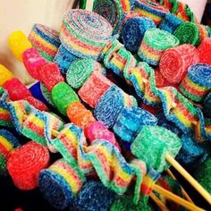 a pile of colorful lollipops sitting next to each other