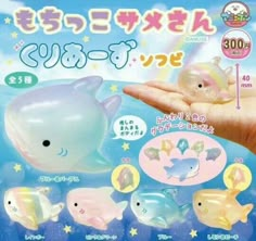 an advertisement for toys in japanese language with dolphins and fish on the front, one dolphin is