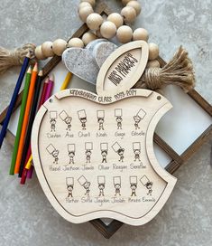 an apple shaped wooden ornament with instructions on it