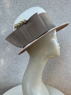 "Vintage white straw bowler style hat wide taupe grosgrain ribbon accent and hat pin sz 22 by Bullocks Los Angeles. Good to ok condition, Original netting over crown area has been remove ( damaged) and has some wear. Interior Brim lined with fabric. Measurements  Interior band 22\" Crown height 5\" Hat width 11\" Brim width 2\" Weight 1 pound" Formal Beige Fedora With Short Brim, Cream Fedora Hat For Formal Occasions, White Fitted Fedora For Kentucky Derby, Fitted White Fedora For Kentucky Derby, Beige Curved Brim Fedora For Formal Occasions, Formal Cream Fedora Hat, Beige Fedora Hat For Formal Occasions, Elegant Fall Boater Hat With Brim, Elegant Fall Brimmed Boater Hat