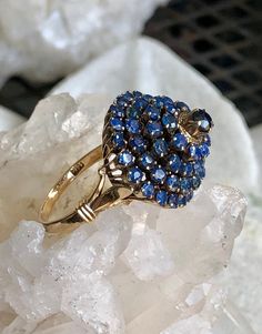 Stunning Circa 1930s Blue Sapphire 14kt Gold Vintage Antique Ring Ring Size 7 weighs 7 grams of gold and gemstones Collectible Sapphire Ring In 14k Gold, Antique Multi-stone Yellow Gold Cluster Ring, Antique Multi-stone Cluster Ring In Yellow Gold, Vintage Blue Cluster Ring With Center Stone, Blue Vintage Cluster Ring With Center Stone, Estate Style Collectible Gemstone Jewelry, Estate Yellow Gold Rings For Collectors, Collectible 14k Gold Multi-stone Rings, Collectible Multi-stone 14k Gold Rings