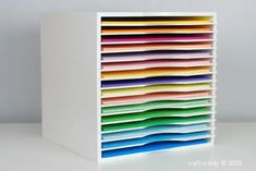 a multicolored file cabinet is shown in this image, it appears to be made out of paper