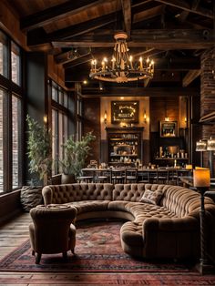 a living room filled with lots of furniture next to a window covered in candles and chandeliers