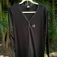 Black Calvin Klein Nightgown Pajama Size Large. Never Worn; Tags On. Soft, Light Weight Cotton Material. Black Long Sleeve Sleep Top, Black V-neck Nightgown For Loungewear, Black Long Sleeve Nightgown For Loungewear, Black Long Sleeve Sleepwear For Lounging, Black V-neck Sleepwear For Lounging, Black Long Sleeve Nightgown For Bedtime, Black Long Sleeve Nightgown, Casual Black Nightgown For Sleepover, Calvin Klein Long Sleeve Tops For Loungewear