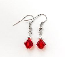 "These beautiful red earrings are made with 8mm red bicones and 4mm sterling plated round beads with nickel free ear wire. Earrings measure 1 1/4\" long. Perfect gift idea for anyone or bridesmaid gift." Red Necklace, Jewelry Techniques, Red Earrings, Diy Crafts Jewelry, Wire Earrings, Matching Necklaces, Star Earrings, Bridesmaid Gift, Ear Wire