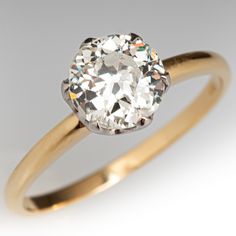 an old mine cut diamond in a yellow gold ring