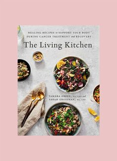 the living kitchen cookbook is shown on a table with plates and bowls filled with food