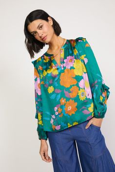 This floral-print blouse offers a welcome punch of color and pattern to the season's ensembles. Detailed with a clean placket and ruffle trim at the shoulders and sleeves, the V-neck top will become an instant favorite. •Split neckline with placket •Long sleeves •Elasticized cuffs •Ruffle trim •Relaxed fit •Relaxed Fit DIMENSIONS •Standard: 24.75" Length Item number 2230399-1100% Polyester Sweater Uniform, Botanical Floral Prints, Floral Tattoo Sleeve, Floral Sleeve, Style 2023, Floral Print Blouses, Woven Top, Floral Ruffle, Green Blouse