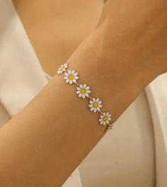 Beautifully cute daisy chain bracelet perfect start to spring,  A sweet gift for a friend, partner or yourself.  A pretty piece that's perfect for all occasions. Trendy Bracelets As Spring Gift, Trendy Bracelets For Spring As A Gift, Spring Dainty Bracelet Jewelry, Delicate White Bracelets For Spring, Cute Spring Bracelet Jewelry, Spring Bracelets With Adjustable Flower Decoration, Dainty Flower Bracelets For Mother's Day, Adjustable Bracelet With Flower Decoration For Spring, White Delicate Bracelet For Spring