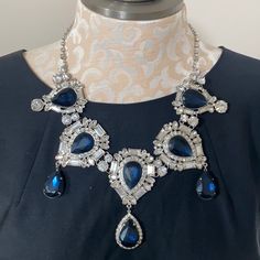 New With Tag! Simply Stunning Statement Necklace! Silver Tone With Deep Blue & Clear Rhinestone Accents. The Center Piece Including Dangle Is Approx 3.5” Long Chain Has 3” Extender To Adjust Length Of Necklace Sapphire Crystal Necklace With Sparkling Stones, Blue Crystal Necklace With Diamond Accents, Blue Crystal Necklaces With Diamond Accents, Blue Evening Necklaces With Sparkling Stones, Sapphire Rhinestone Party Necklace, Evening Blue Necklaces With Sparkling Stones, Blue Necklaces With Sparkling Stones For Evening, Blue Crystal Necklace In Costume Jewelry Style, Blue Rhinestone Necklaces For Evening