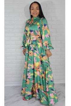 Material: Satin Style: Maxi Dress Long Sleeve Color: Green & Mul Fit True to size. The model is wearing a size Small with 36 Bust Size Recommended Small = 4/6 Medium= 8 Large= 10 XL = 12 1XL= 14 Multicolor Floral Printed Dress For Garden Party, Multicolor Floral Dress With Vibrant Print For Garden Party, Vibrant Multicolor Floral Dress For Garden Party, Green Floral Print Long Sleeve Maxi Dress, Colorful Floral Print Dress For Brunch, Green Long Sleeve Maxi Dress With Floral Print, Colorful Casual Floral Print Dress, Long Sleeve Green Maxi Dress With Floral Print, Multicolor Print Midi Dress For Spring Garden Party